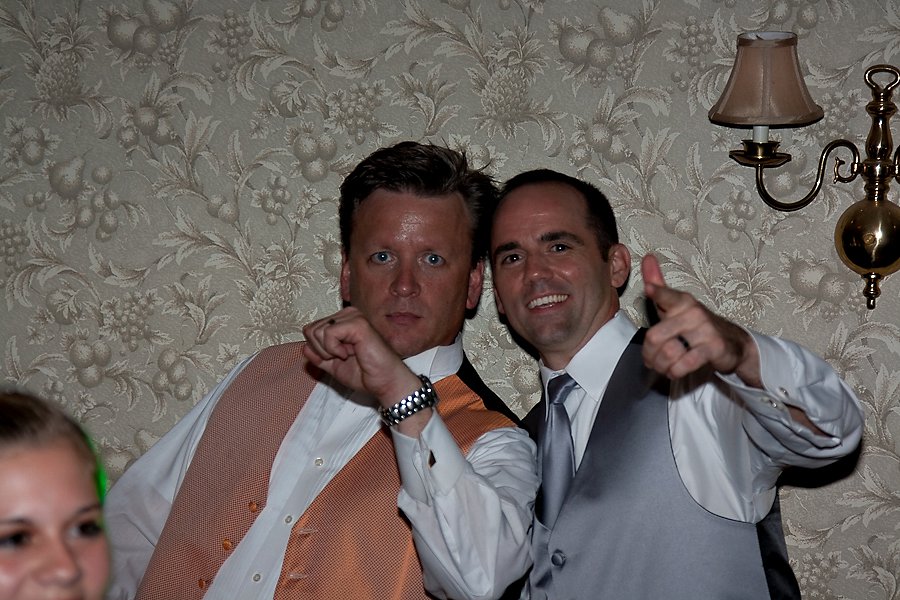 Two guests dancing at a wedding reception