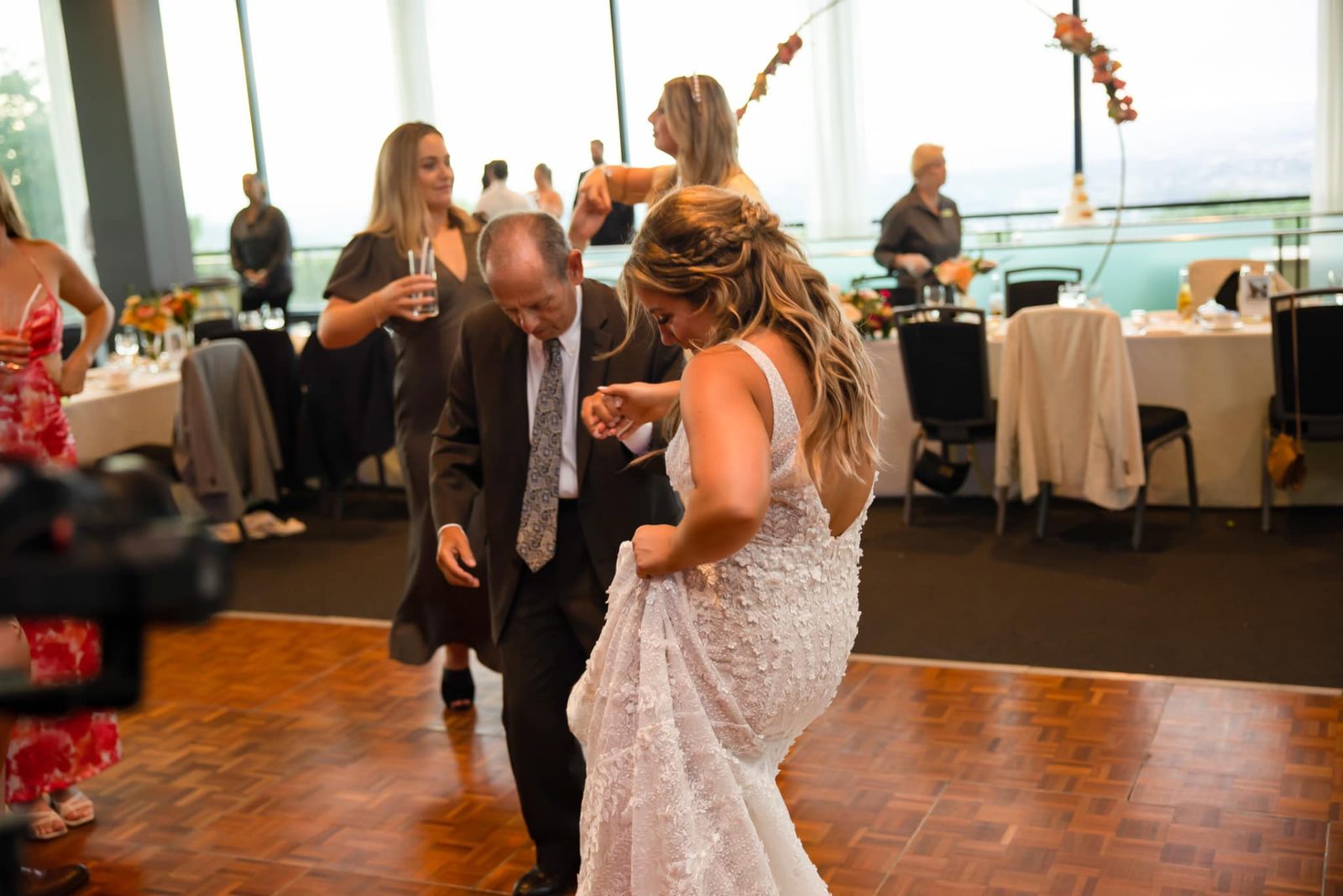 Bride dancing with a wedding guest