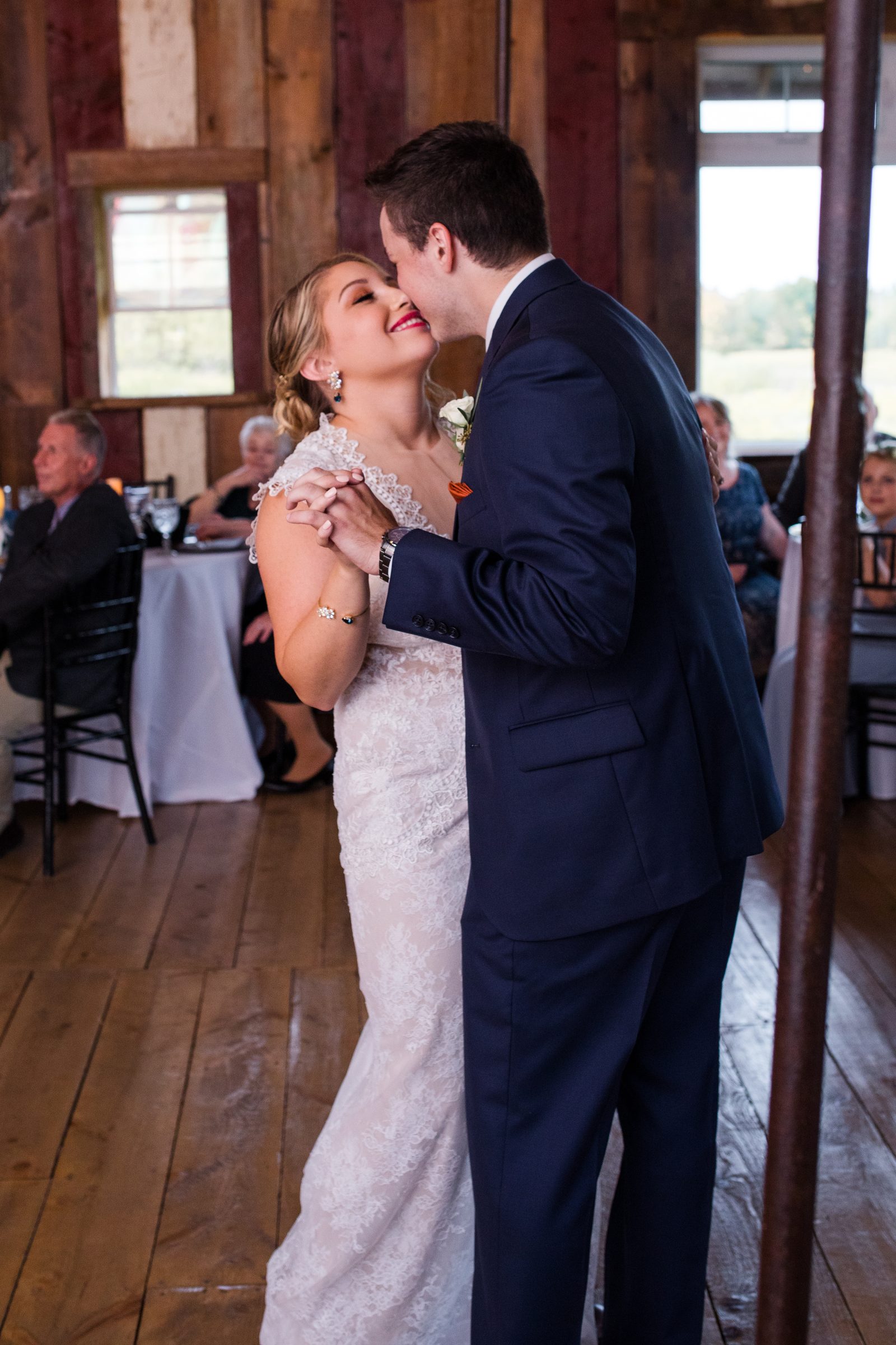 Bride and groom sharing a kiss on the dance floor